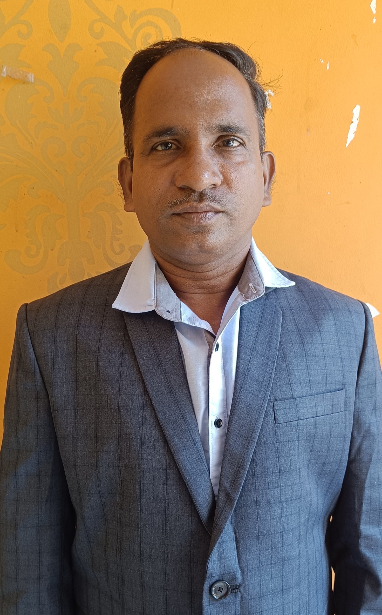 Dr. TARINI PRASAD PUHAN